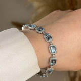 Emerald Shape 11 Carat Aquamarine Tennis Bracelet Featuring Diamond Halo BRHAEC HEERA DIAMONDS