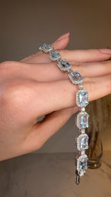 Emerald Shape 11 Carat Aquamarine Tennis Bracelet Featuring Diamond Halo BRHAEC HEERA DIAMONDS