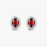 18ct White gold Natural Diamond 15pt and garnet 1.46ct stud earrings.