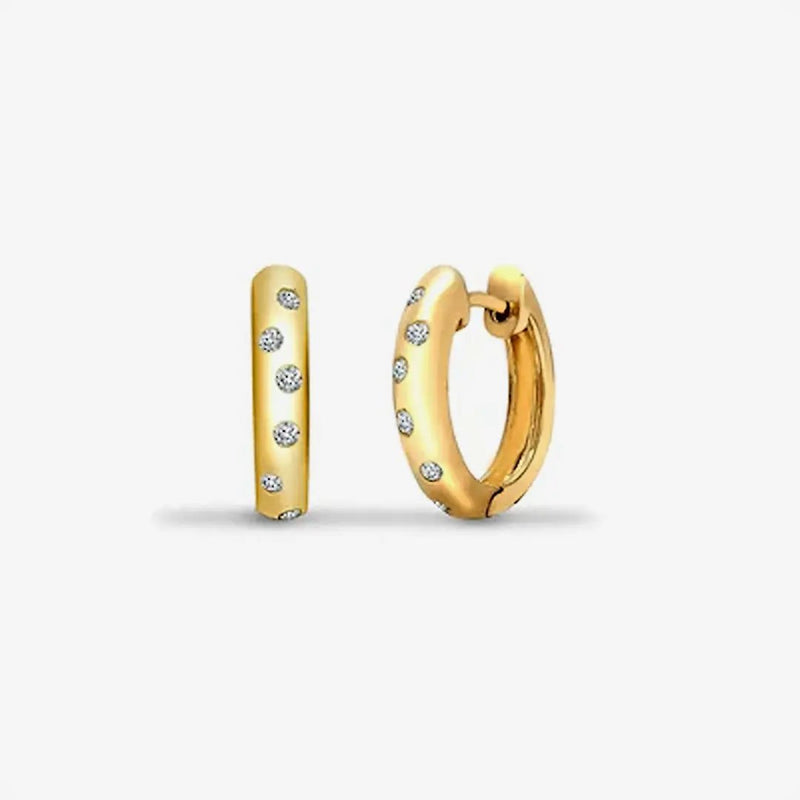 9ct yellow gold 25pt diamond huggie earrings with a hinge and a notched post fixing. HEERA DIAMONDS