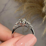 "Arianna" Oval Cut Diamond Shoulders Engagement Ring Life Style- Side View3