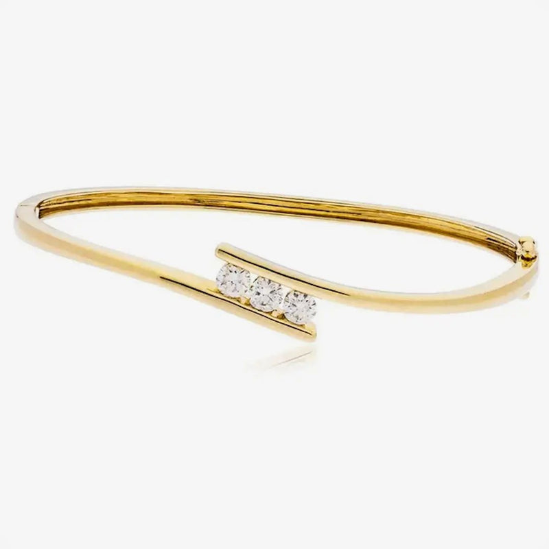 DIAMOND THREE STONE CROSS OVER BANGLE IN 18K YELLOW GOLD HEERA DIAMONDS