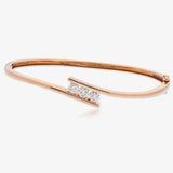 DIAMOND THREE STONE CROSS OVER BANGLE IN 9K ROSE GOLD HEERA DIAMONDS