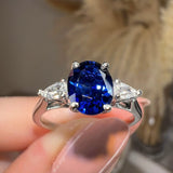 "Gwen" Trilogy 2 Carat Oval Cut Blue Sapphire Pear Shoulders Platinum Engagement Ring - HEERA DIAMONDS