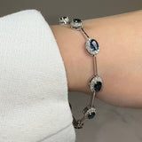 Oval Shape Sapphire Featuring Diamond Halo 18K White Gold Station Set Bracelet - HEERA DIAMONDS