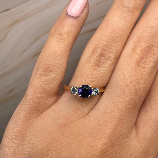 "Bluzz" Round Cut 1.5 Carat Blue Sapphire Trilogy Yellow Gold Engagement Ring 3SRB51