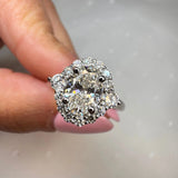 "Lina" Oval Cut 1 carat halo Platinum Engagement Ring Life style- front view