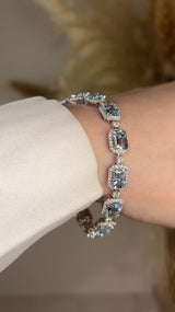 Emerald Shape 11 Carat Aquamarine Tennis Bracelet Featuring Diamond Halo BRHAEC