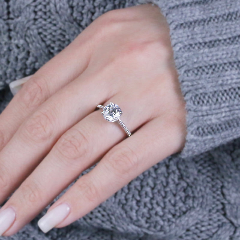 Eleanor-Round-brilliant-engagement-ring-with-grain-setting-diamond-shoulders-in-platinum - HEERA DIAMONDS
